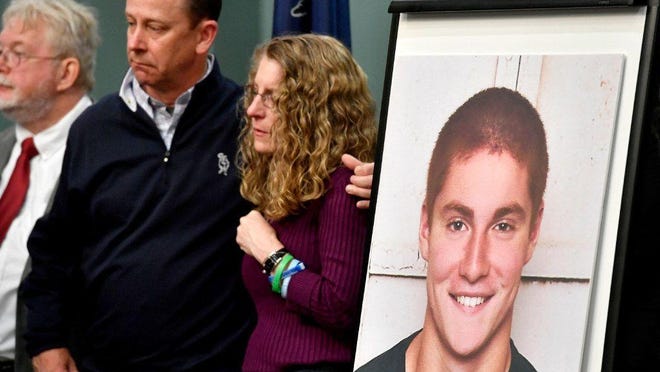 Jim and Evelyn Piazza stand by as Centre County District Attorney Stacy Parks Miller announces the results of an investigation into the death of their son, Timothy Piazza (in photo at right), a Penn State University fraternity pledge, during a press conference on May 5, in Bellefonte, Pennsylvania.
