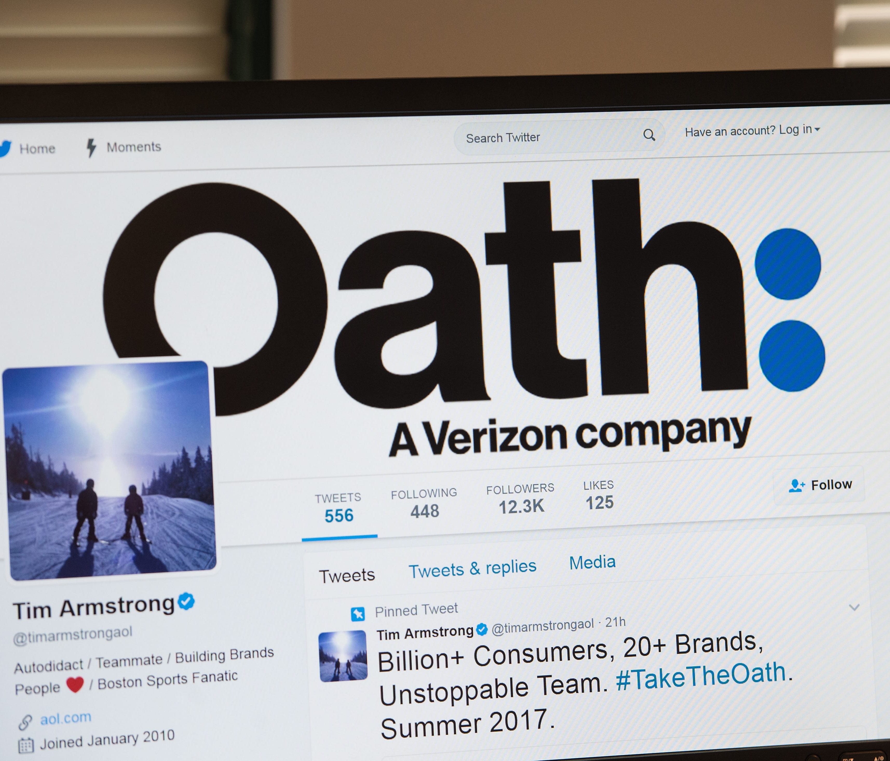 A man looks at the Twitter page of AOL CEO Tim Armstrong announcing Oath on a computer in Washington, DC, on April 4, 2017. With its acquisition of Yahoo official Tuesday, Verizon will combine AOL and Yahoo will be combined into a unit called 