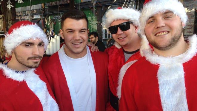 Left to right: Teddy Benedict, Tom Holland, Shane Byron and Matt Betz were in a festive mood at Johnny Mac House of Spirits during Asbury Park's annual SantaCon event Dec. 12, 2015.