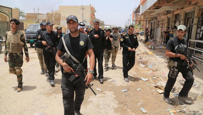 Iraqi security forces patrol Fallujah, Iraq, on June 28, 2016.