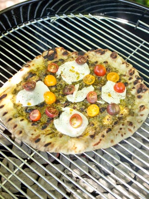 Pesto Heirloom-Tomato Pizza prepared on the grill.