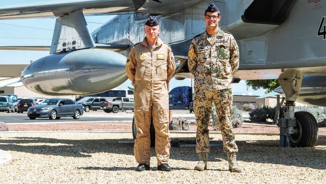 Commanding Director of the German Air Force Flying Training Center (GAFFTC) Col. Stephan Breidenbach and Oktoberfest Project Officer Armin Trost stand in front of a Tornado at Holloman Air Force Base.  Oktoberfest will be held Saturday, Sept. 10.