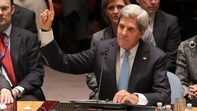 Secretary of State John Kerry votes to approve a resolution that will require Syria to give up its chemical weapons during a Security Council meeting at U.N. headquarters.