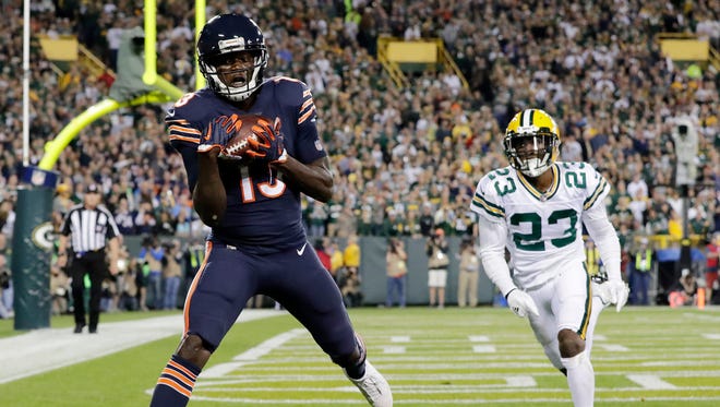 Chicago Bears wide receiver Kendall Wright (13) catches a touchdown pass beyond the coverage of Green Bay Packers cornerback Damarious Randall (23) in the second quarter on Thursday, September 28, 2017 at Lambeau Field in Green Bay, Wis.