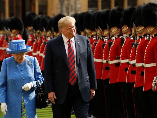   President Trump and Queen Elizabeth II inspect a guard 