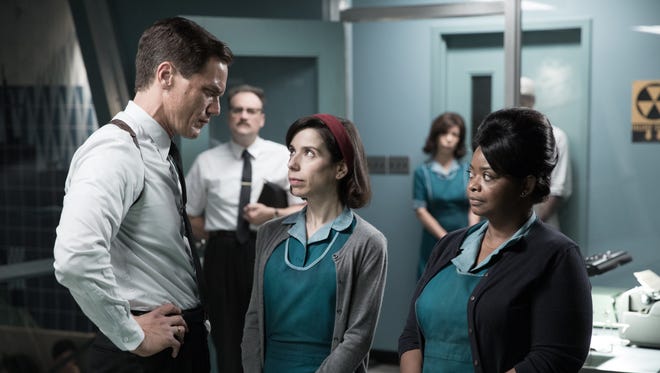 A government agent (Michael Shannon) suspects Elisa (Sally Hawkins, center, with Octavia Spencer) has helped the "fish-man" escape in 'The Shape of Water.'