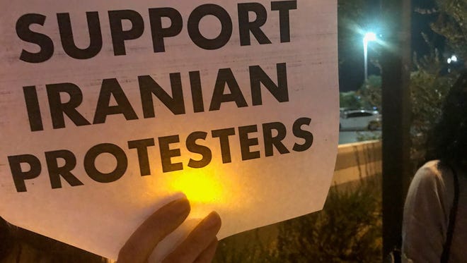 On Jan. 4, 2018, several dozen people showed up at a gathering in central Phoenix carrying signs and candles in support of Iranian protesters.