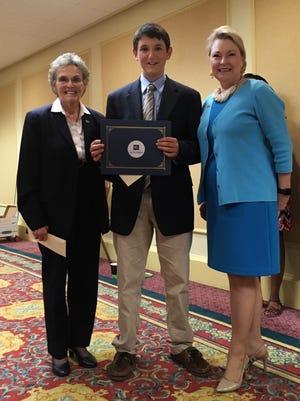 Dr. Susanne Homant, left, participant Riley Littlefield and Karen Moore pictured after Littlefield's presentation on increasing civic participation among Floridians.