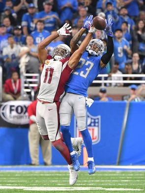 Lions cornerback Darius Slay knocks away a reception