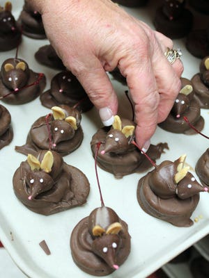 Chubby, chocolate-drenched church mice have a maraschino cherry for a belly and tail.