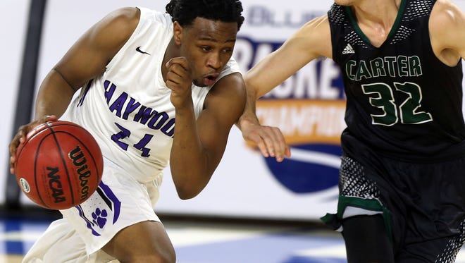 Haywood's Alandis Delk dribbles up court against Carter's Austin Hayes in the first half Thursday, March 12, 2015 in the Class AA state quarterfinals at MTSU.