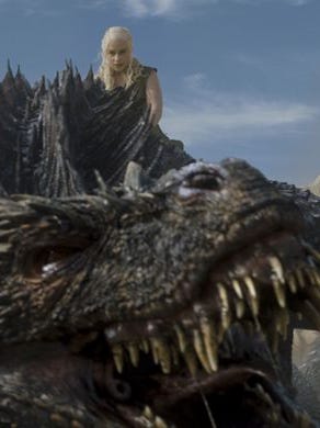 Daenerys Targaryen climbs on top of Drogon in "Battle of the Bastards," episode 9 of Game of Thrones' season 6.