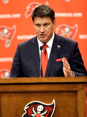 Tampa Bay Buccaneers general manager Jason Licht  gestures in a 2014 news conference.