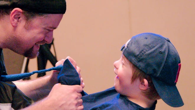 David Perry and son Nico, who has Down syndrome, in 2015 in Bloomington, Minn.