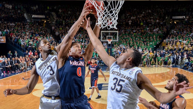 Jan 24, 2017; South Bend, IN, USA; Notre Dame Fighting Irish forward V.J. Beachem (3) Virginia Cavaliers guard Devon Hall (0) and Notre Dame Fighting Irish forward Bonzie Colson (35) fight for a rebound in the first half at the Purcell Pavilion. Virginia won 71-54. Mandatory Credit: Matt Cashore-USA TODAY Sports
