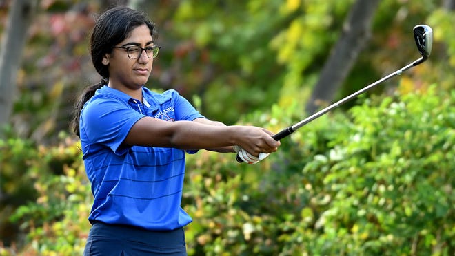 Ashland sophomore Keira Joshi sizes up a tee shot during Tuesday's match against Medway at Pinecrest Golf Club in Holliston. Joshi was the low score for the Clockers on Tuesday as Ashland defeated Holliston on a tie-breaking seventh card, 43-48.