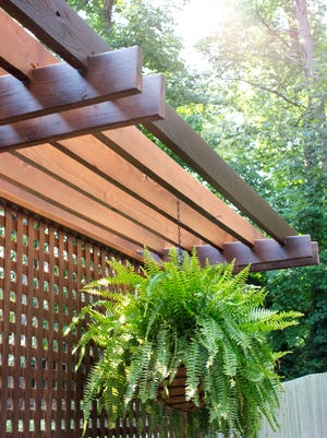 In this photo provided by courtesy of Wood, Naturally and Woodnaturally.com, this partial shade cover featured on Woodnaturally.com shows homeowners how to add adequate shade above exterior seating areas which may receive too much direct sunlight. Partial shade covers are an excellent choice for homeowners who wish to keep portions of their deck exposed to the elements for sunbathing or container gardening. (AP Photo/Wood, Naturally, Woodnaturally.com)