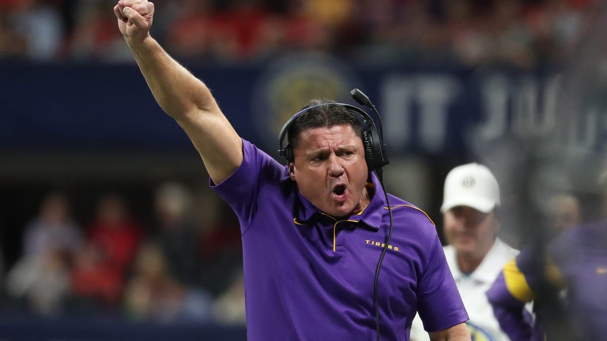 Dec 7, 2019; Atlanta, GA, USA; LSU Tigers head coach Ed Orgeron reacts after a catch by wide receiver Terrace Marshall Jr. (not pictured) in the first quarter against the Georgia Bulldogs in the 2019 SEC Championship Game at Mercedes-Benz Stadium. Mandatory Credit: Jason Getz-USA TODAY Sports ORG XMIT: USATSI-419478 ORIG FILE ID:  20191207_gav_gb1_071.jpg