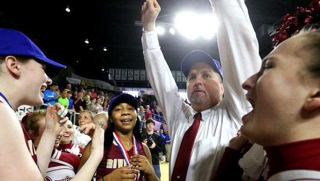 Riverdale coach Randy Coffman greets the crowd after his team defeated Oak Ridge to win the Class AAA state championship in March 2016. Coffman was named Naismith National Coach of the Year Monday while star senior Anastasia Hayes (to his right) was named Gatorade Tennessee Player of the Year.