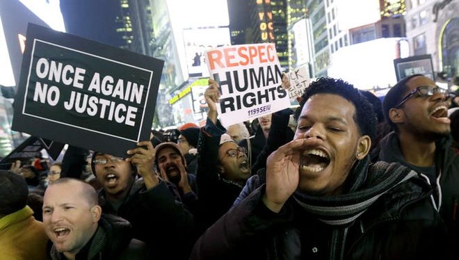 Protesters gather in New York City after it was announced no indictment would be sought in the death of Eric Garner.