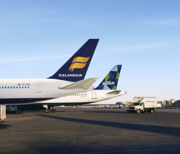 This image provided by Icelandair shows the tails of planes for Icelandair (front) and JetBlue.
