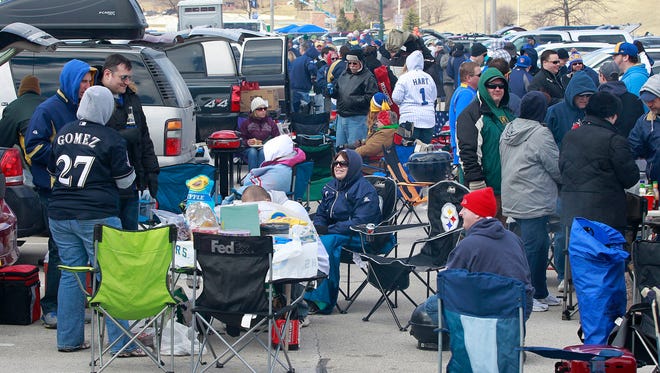 Tailgating before a Milwaukee Brewers Opening Day game is often a chilly undertaking. The Brewers take on the St. Louis Cardinals in Milwaukee's home opener at 4:14 p.m. on Thursday at American Family Field. Tailgaters will have sunny skies with temperatures in the mid-40s, but the wind will be howling, with gusts up to 50 mph, forecasters say.