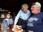 Marie Hainline jokes with Alan and Julie Scott as she