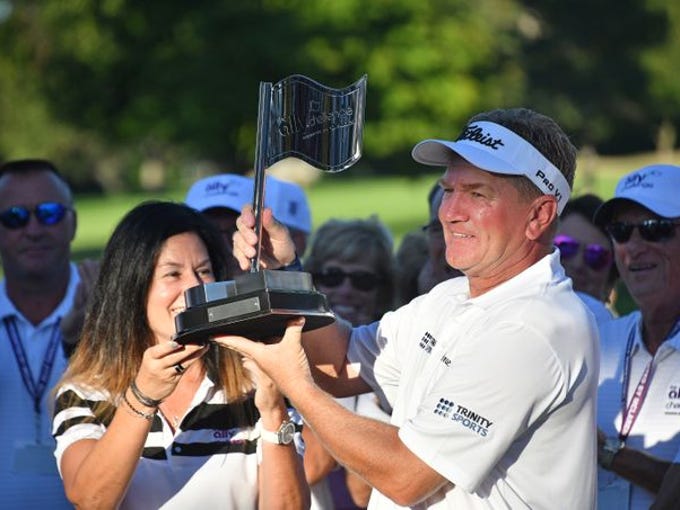 Paul Broadhurst is awarded the trophy for winning the