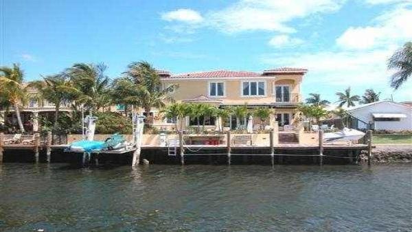 The rear of the large waterfront home Seth Beoku Betts bought in Florida’s Palm Beach County with money he stole from Ball State University.