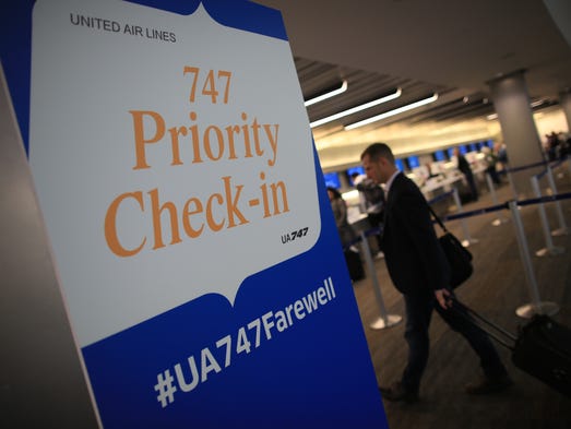Passengers check in for United Airlines' special Boeing