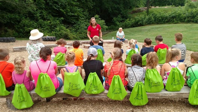 Tammi Rogers of Coshocton County Litter Prevention teaches junior master gardeners about worms and composting at Clary Gardens in this Tribune file photo. Rogers said there is an uptick in recycling as more people are staying home during the coronavirus pandemic. She is exploring the idea of reading children’s books on littering she has and doing some other tutorials on the recycling and litter prevention office’s Facebook page.