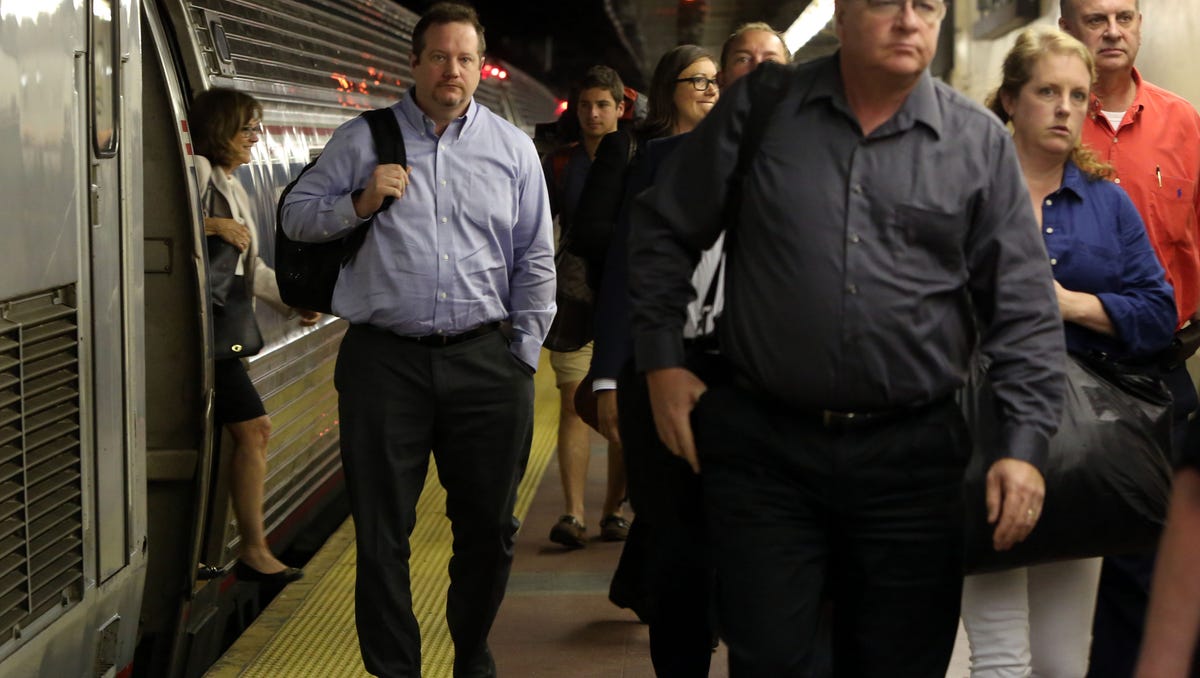 Commuters aboard the 7:30 a.m. Amtrak train from Albany arrive at Grand Central Terminal in Manhattan July 10, 2017. Six Amtrak trains, three in and three out, will be routed into Grand Central Terminal each day as Amtrak performs eight week's worth of repair work over the summer.