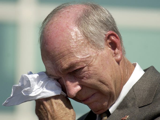 Former Green Bay Packers quarterback Bart Starr wipes away a tear during a dedication ceremony for a statue in his honor outside the Resch Center in Ashwaubenon on Sept. 9, 2004.