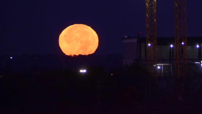 The Supermoon sets over the Meadowlands Monday morning.