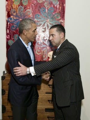 President Barrack Obama shakes hands with Josh Pellerin of Pellerin Energy Group.