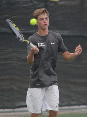 Luke Tebow hits a forehand during a match against Lubbock Monterey's Judah Baldwin, on Saturday he helped the Abilene tennis team win one of its three doubles matches against  Richland.