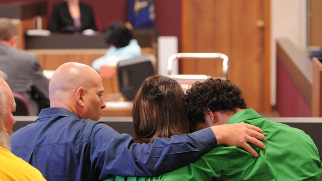 The Skinner family keep their heads down as they listen to testimony during the 2011 trial of Jonathan Kurtz. Mara McCalmon said she hopes the victims are remembered in the upcoming rulings regarding juvenile offenders.