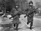 Two army ROTC members jog  along Scottsville Road as