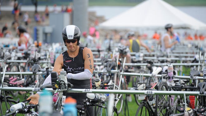 Participants of Ironman Louisville 2014 start their 112-mile bike ride on Sunday. (By David Lee Hartlage, Special to the C-J) Aug. 24, 2014.