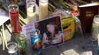 Mementos, candles and flowers are left at a makeshift