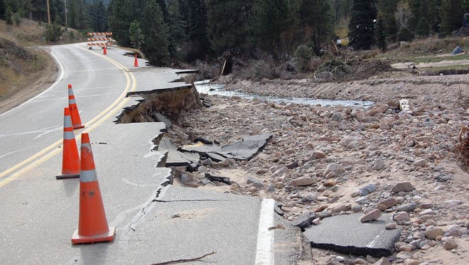 A flood-damaged section of Larimer County Road 43 between Glen Haven and Estes Park, Colo.