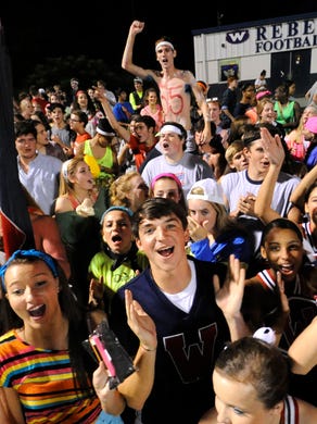 West fans cheer on their team following their 25-16 home victory over Farragut in a high school football game at West High School in Knoxville on Friday, Sept. 20, 2013.