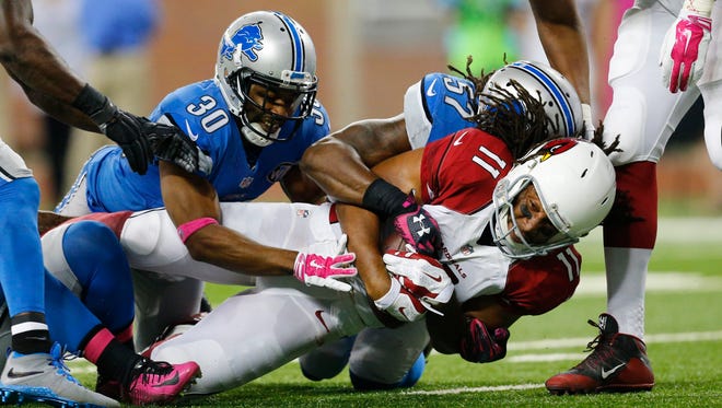 Detroit Lions defensive back Josh Wilson makes a tackle against the Arizona Cardinals on Oct. 11, 2015, in Detroit.