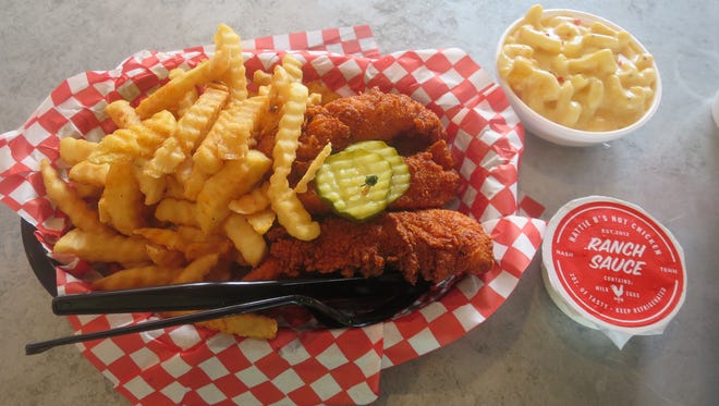 The most popular order at Hattie B’s is the hot chicken tenders with mac and cheese, fries and ranch dressing. These are medium heat, which is pretty spicy.