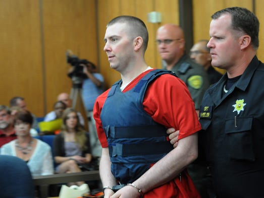 Convicted murder is led into court July 30, 2010, for