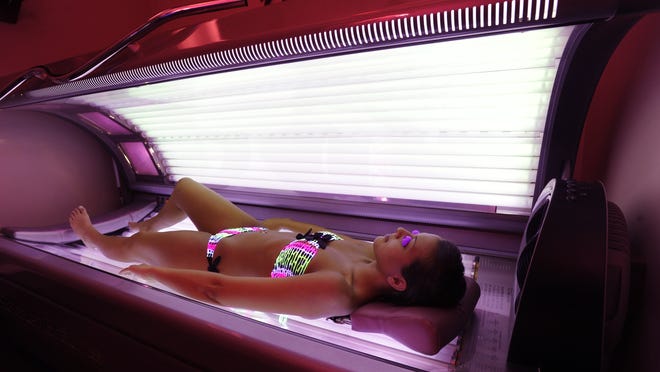 Increased exposure to ultraviolet radiation from tanning booths may be part of the explanation in the rise in melanoma among young people.