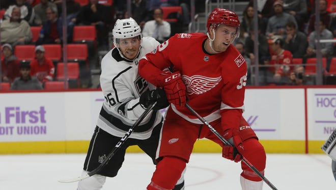 Red Wings forward Anthony Mantha is defended by the Kings' Nic Dowd during the first period of the Red Wings' 4-1 loss to the Kings on Tuesday, Nov. 28, 2017, at Little Caesars Arena.