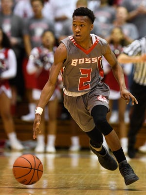 Bosse’s Mekhi Lairy brings the ball down court as the Evansville Bosse plays Crispus Attucks in the Boys’ Semi-State Basketball Tourney at Seymour High School Saturday, March 18, 2017.