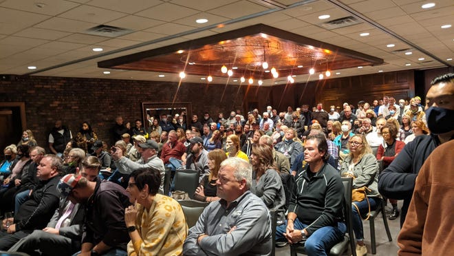 More than 100 people listen to Illinois attorney Tom DeVore on Thursday at Giovanni's in Rockford, as he encourages area bar and restaurant owners to stay open this weekend despite Gov. JB Pritzker's COVID-19 mitigation orders.