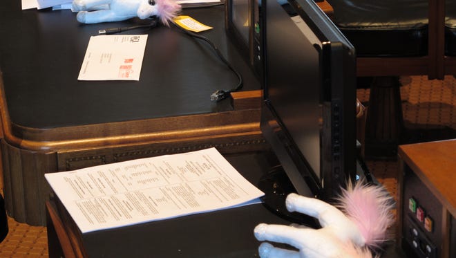 Stuffed animal unicorns are placed on the desks of lawmakers in the Louisiana House, distributed by a group supporting the Common Core education standards on Wednesday, April 15, 2015, in Baton Rouge, La. The organization suggests that many of the claims from opponents of Common Core are not real, just like unicorns. (AP Photo/Melinda Deslatte)